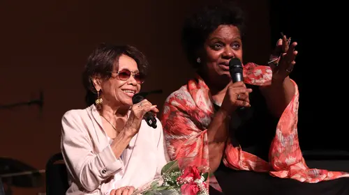 Kirsten Childs (right) talking with Micki Grant (left) on stage talking about writing and composing for musical theatre, after the July 28, 2018 matinee of Don't Bother Me, I Can't Cope, the third production of the Encores! Off-Center season at New York City Center. Photo by Lia Chang.