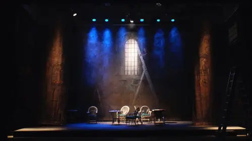 Theatre stage with chairs and theatre lights on